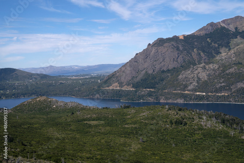 View of the forest, valley and hills surrounding lake Gutierrez in Bariloche, Patagonia Argentina.