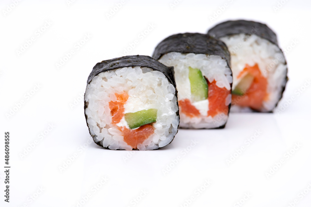 Sushi roll with salmon isolated on a white background Sushi roll with salmon isolated on a white background