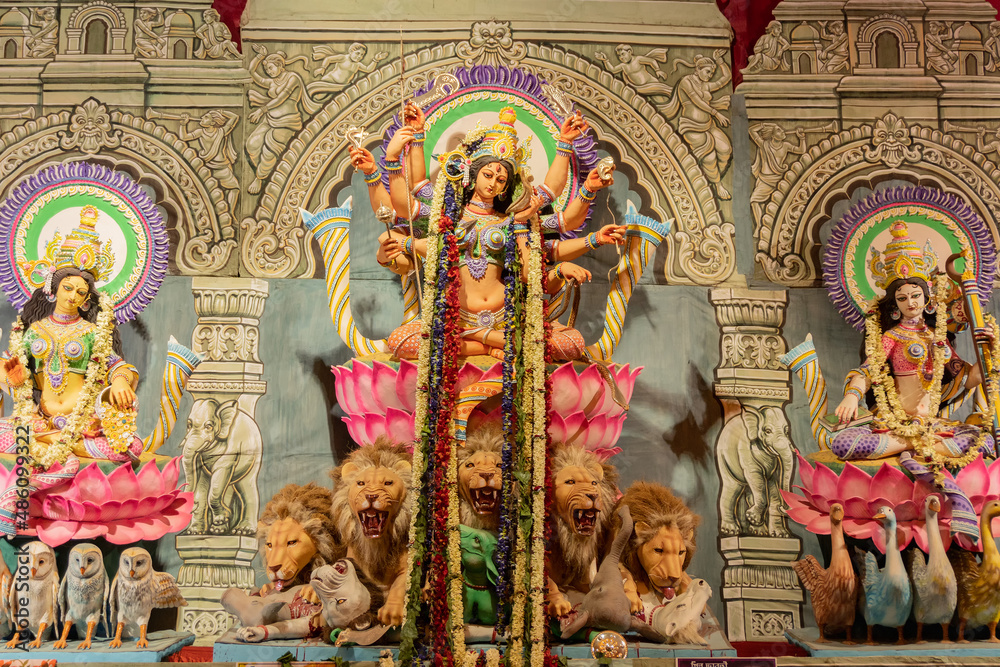 Goddess Durga idol at decorated Durga Puja pandal, at Kolkata, West Bengal, India. Durga Puja is biggest religious festival of Hinduism and is now celebrated worldwide.