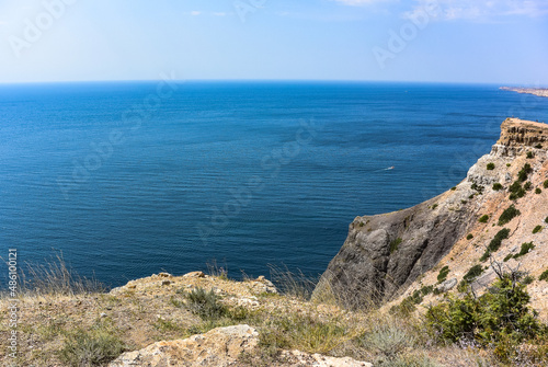 Cape Fiolent in Balaklava, Russia. View from the top of the cliff. azure sea, sunny day against a clear sky.