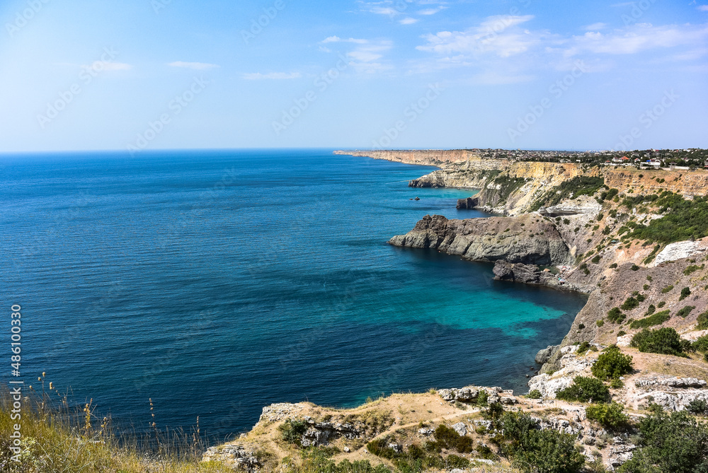 Cape Fiolent in Balaklava, Russia. View from the top of the cliff. azure sea, sunny day against a clear sky.