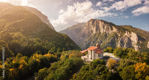 Tableau sur toile Aerial drone panoramic view of a little church on a cliff in deep canyon near legendary Mountain Olympus - the pantheon of all Greek gods and Great Zeus