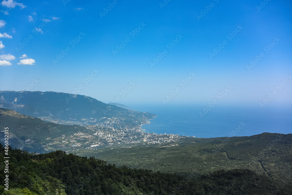 Picturesque view of the city of Yalta and the Black Sea from Ai Petri mountain in the Crimea. Russia.