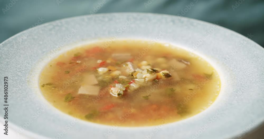 Minestrone soup. Vegetarian healthy meal for dinner. Ready vegetable meal for lunch, hot and cozy soup for dinner at home. plate with ready-made soup. Minestrone soup. Vegetarian healthy meal for dinner. Ready vegetable meal for lunch, hot and cozy soup for dinner at home. plate with ready-made soup.