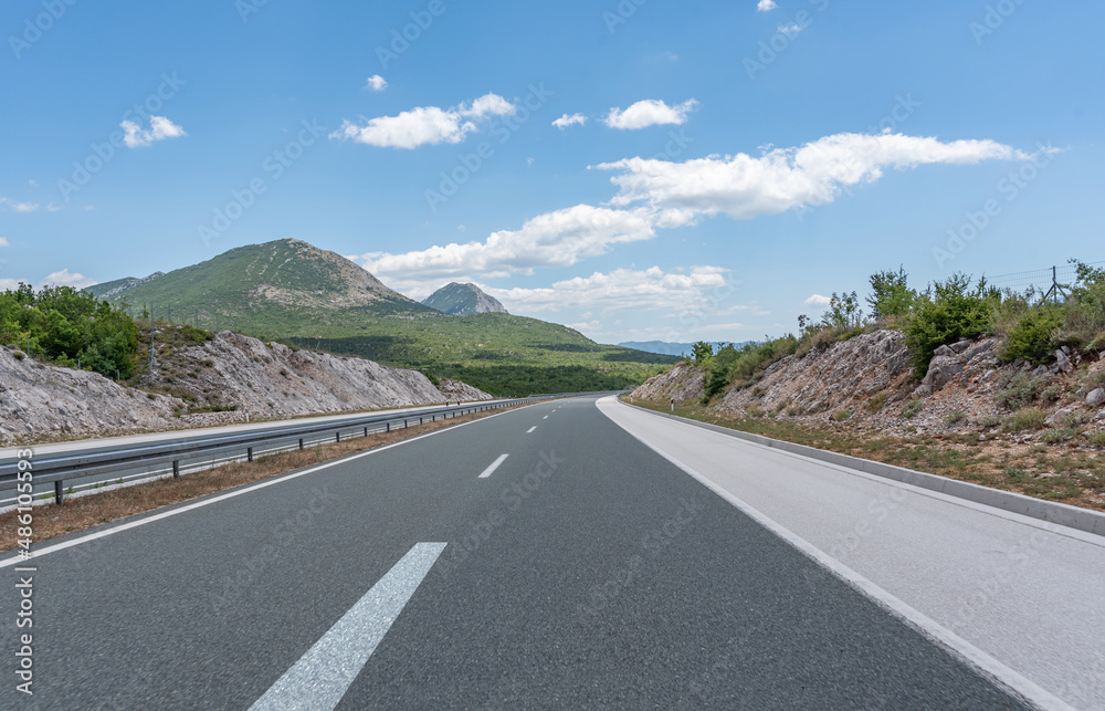 Scenic road. The road is surrounded by a magnificent natural landscape. Scenic road. The road is surrounded by a magnificent natural landscape.