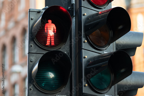Close-up of a red color at a traffic light at a pedestrian crossing.
