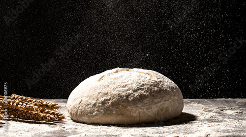 yeast dough for bread or pizza on a floured surface, with flour splash. Cooking bread. Kneading the Dough. Long banner format.
