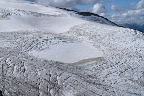 View of Glacier Alerce seen from the the top of Tronador hill in the Andes cordillera. The beautiful white ice field in the mountains.  photo