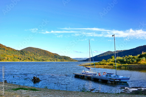 Sailing boats at the pier on the shores of Klimkowka Lake in South Poland photo