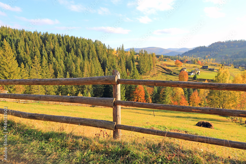 wooden fence on village meadow