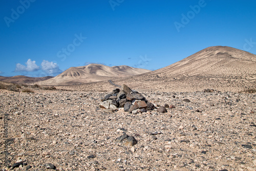 typical cairn marking and landscape in the interior of the Canary Island of Fuerteventura