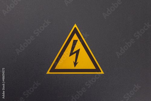 Electric shock hazard sign on the electrical panel door