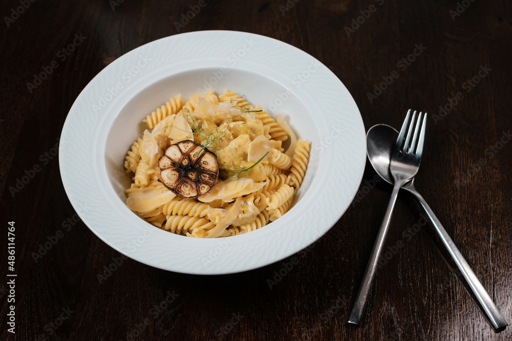 Pasta with herbs. Traditional Italian dish served on restaurant table. Pasta with herbs. Traditional Italian dish served on restaurant table.