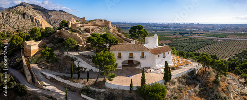 High angle panoramic view of Hermitage of La Magdalena and Old Castle ruins on top of the hill in Castello  photo
