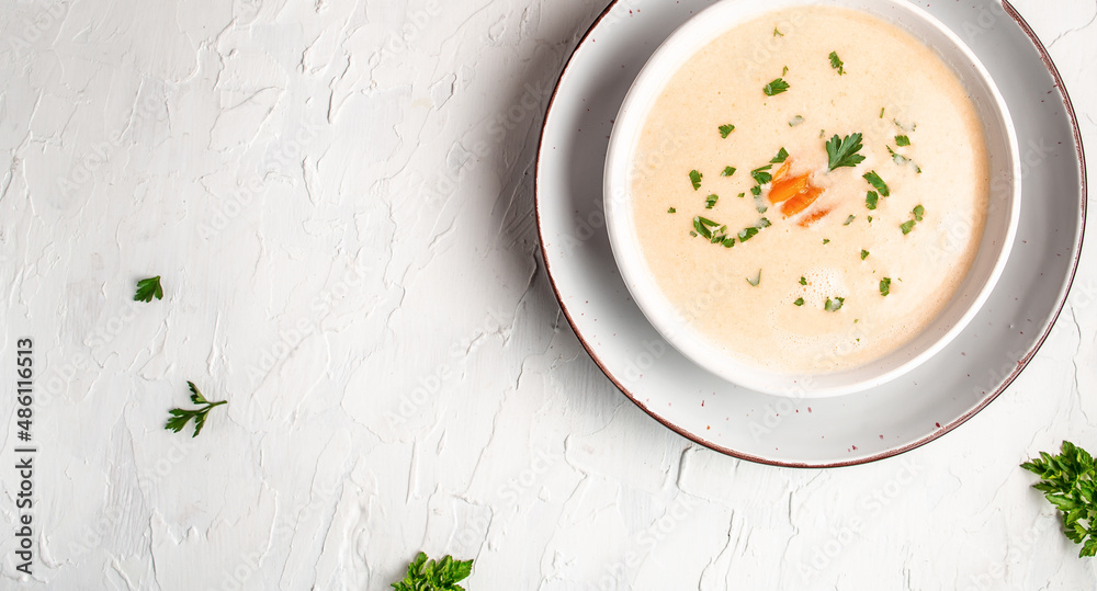 Diet detox food concept. Healthy broccoli cream soup in bowl on light background. Food recipe background. Close up Diet detox food concept. Healthy broccoli cream soup in bowl on light background. Food recipe background. Close up