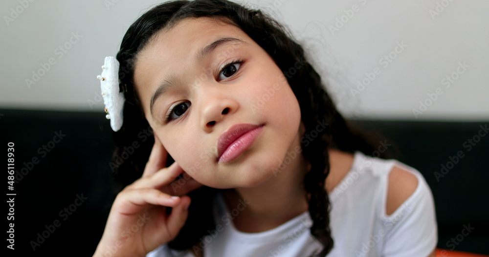 Thoughtful little girl child thinking, pensive kid Thoughtful little girl child thinking, pensive kid