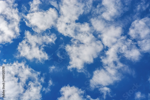Bright blue sky with white clouds  for use as an abstract background and textures.