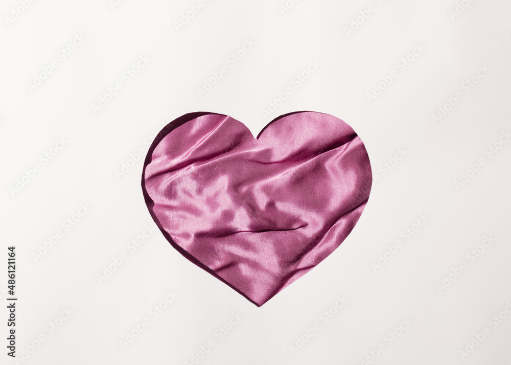 Heart from silk on a white background. Flat lay. Minimal love concept ideas for Valentine's Day Heart from silk on a white background. Flat lay. Minimal love concept ideas for Valentine's Day