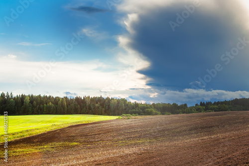  Rain cloud over part of an agricultural field. 
