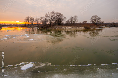 The river is covered with ice, ice floes are floating, winter,element, dawn, sunset, freezing, the power of nature, global warming, flood, floodspring, March, April