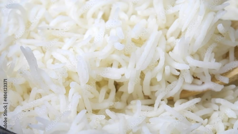 Slow motion of cooked white rice Slow motion of cooked white rice