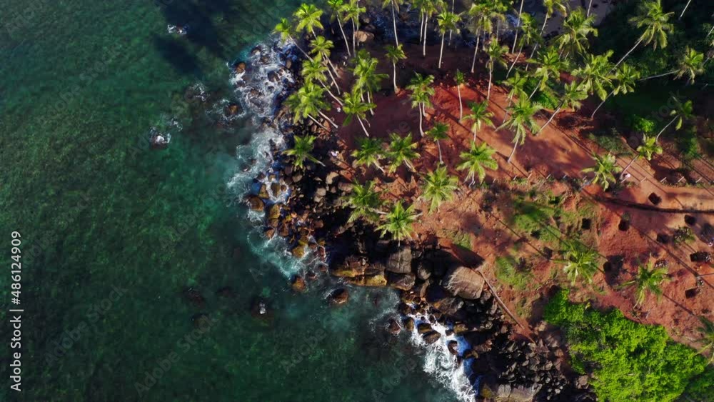 Famous Coconut Tree Hill aerial top view 4K video is a beautiful Nature's landmark in Mirissa, Matara District on Sri Lanka. Exotic Asian countries and around the World traveling concept. Famous Coconut Tree Hill aerial top view 4K video is a beautiful Nature's landmark in Mirissa, Matara District on Sri Lanka. Exotic Asian countries and around the World traveling concept.