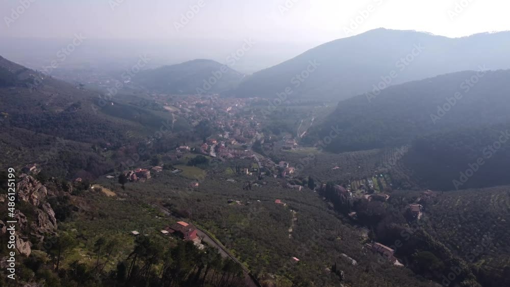 Aerial view of town amidst beautiful mountains, the natural scenery of the Pisa Aerial view of town amidst beautiful mountains, the natural scenery of the Pisa
