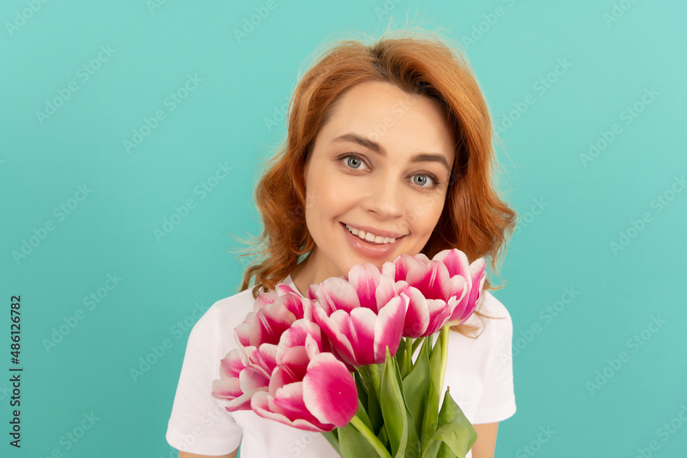 happy woman face with tulip flower bouquet on blue background