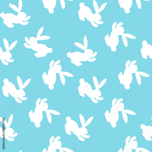 Seamless pattern with white silhouette Easter rabbits on blue background. Design for card, postcard, wallpaper, fabric, textile. Vector stock illustration. Cartoon style