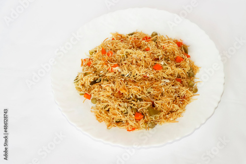 Vegetable Vermicelli Upma Or Semiya Upma In Plate. Isolate White Background