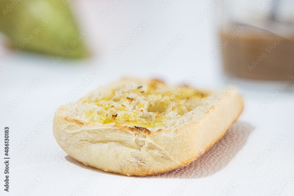 Breakfast of toasted bread with extra virgin olive oil, pear and coffee with milk, healthy food concept Breakfast of toasted bread with extra virgin olive oil, pear and coffee with milk, healthy food concept
