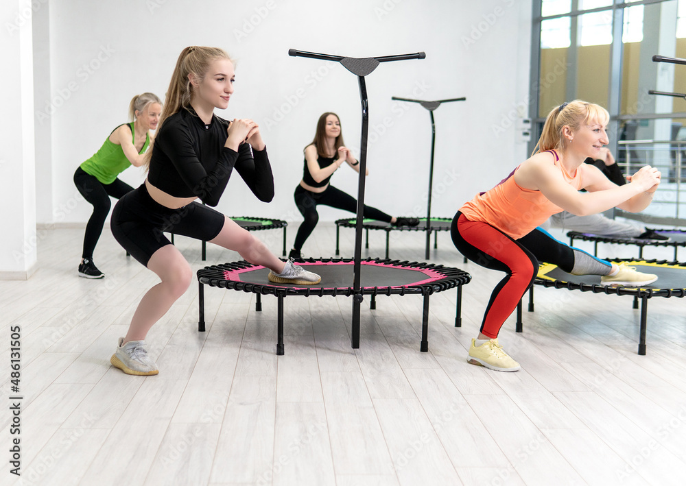Trampoline for fitness girls are engaged in professional sports, the concept of a healthy lifestyle jumping trampoline woman fitness jump training, from workout active for activity from energy