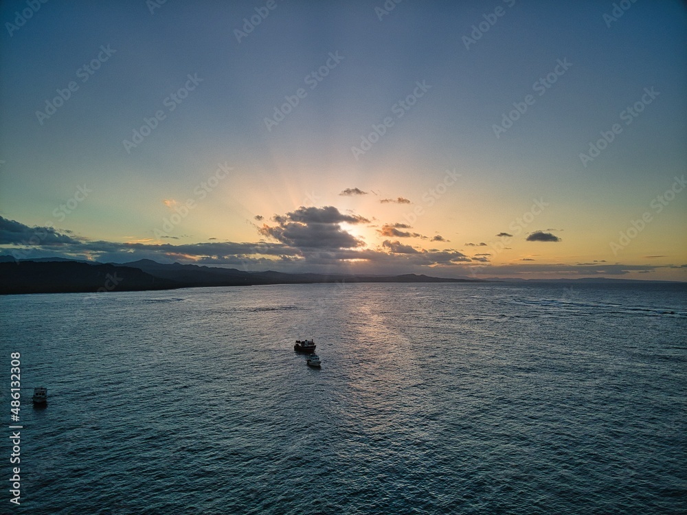 Fototapeta premium sunset at sea, sunset, boats