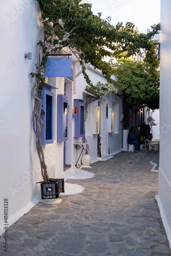 Fototapeta Naklejka Na Ścianę i Meble -  Greece, Milos island. Souvenir shop bougainvillea alley at Chora town Plaka Melos Cyclades.