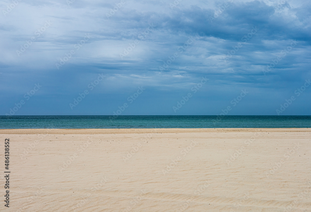 Sand, sea and sky in Cadiz, Spain.