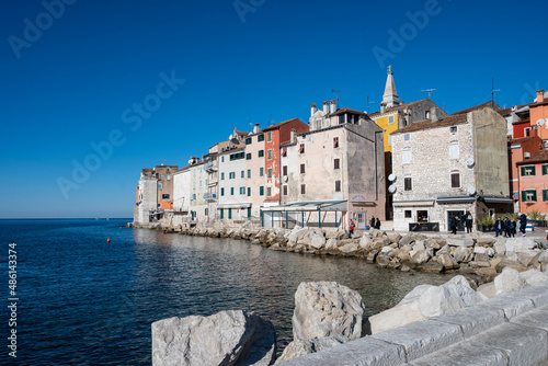 Beautiful Rovinj houses built right on the edge of the sea on the rocky peninsula above water
