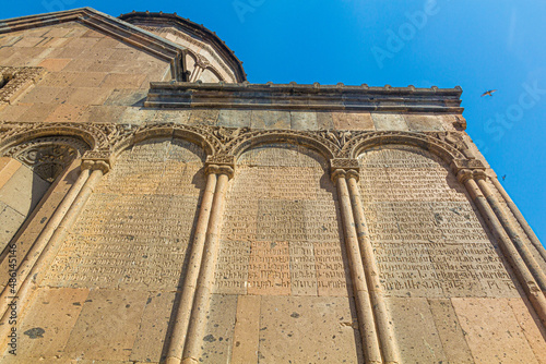 ANI, TURKEY - JULY 18, 2019: Old inscriptions at the Church of St Gregory of Tigran Honents in the ancient city Ani, Turkey photo