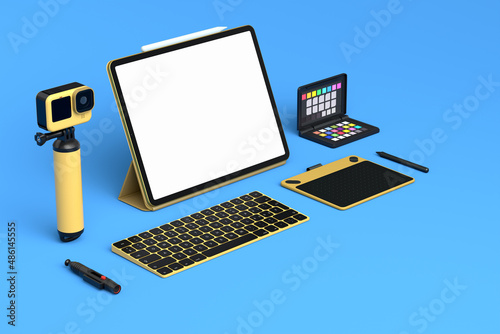 Desktop computer with keyboard, action camera and digital tablet on blue