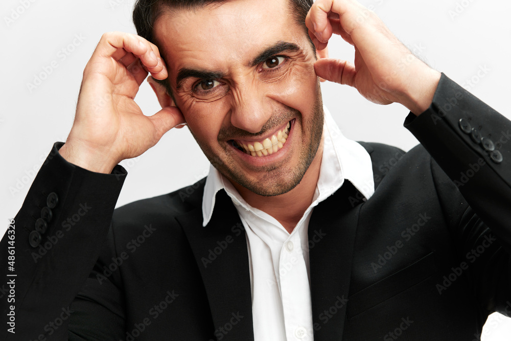 man in a modern suit emotion self-confidence official business and office concept man in a modern suit emotion self-confidence official business and office concept