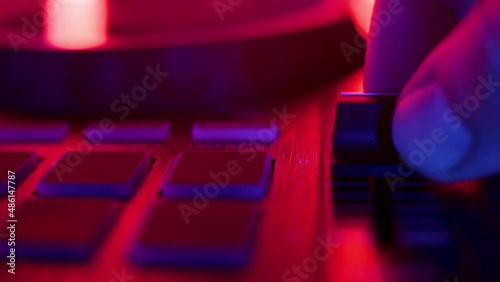 DJ mix studio audio tracks mixing buttons pads decks mixing console .press button cue loop. low mid high frequencies