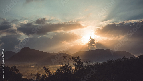 Morning view of mountain landscape with fog on sky and clouds background in Phatthalung province, Southern of Thailand.