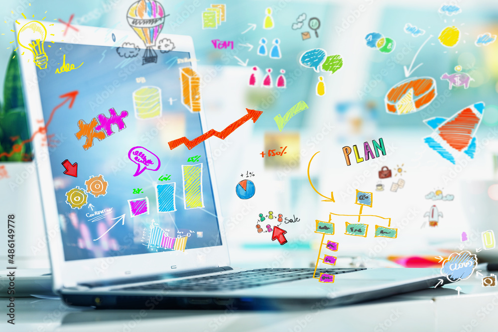 Laptop with sketches of a startup creative projects