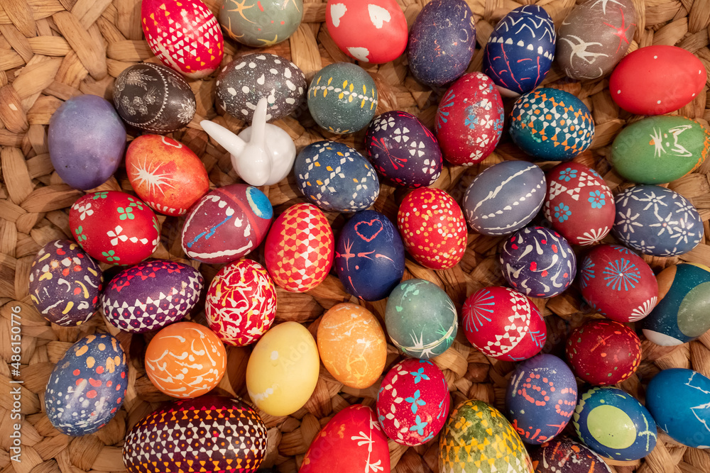 many hand painted colorful easter eggs in a woven basket according to Sorbian tradition many hand painted colorful easter eggs in a woven basket according to Sorbian tradition