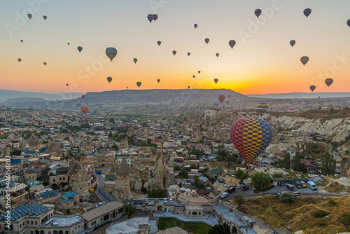 Hot air balloons above Goreme village in Cappadocia, Turkey