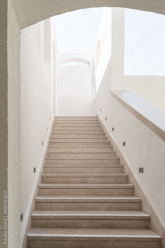 Arabic style architectural details with steps and archway. Staircase with railing going up. Arabic style architectural details with steps and archway. Staircase with railing going up.