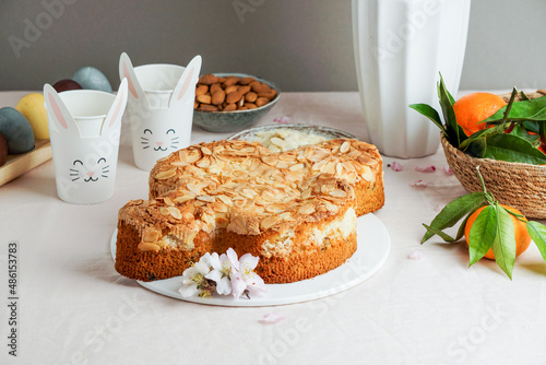 Colomba - traditional italian easter dove cake with glaze, macaranage, almonds