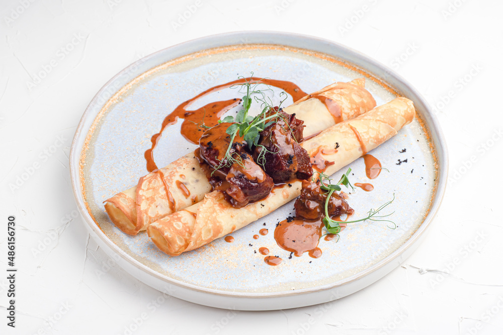 Pancakes with meat, pancakes with beef on a white background, Russian cuisine