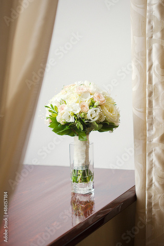 Nice wedding bouquet of roses in a vase