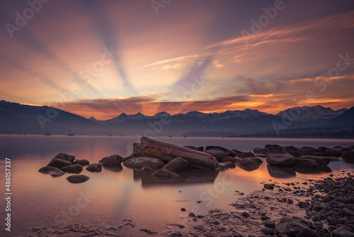 Sunrise lake Thun with swiss alps