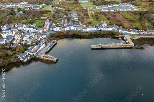 Aerial drone view on fishing town Roundstone in county Galway, Ireland located on Wild Atlantic Way route. Tourism and fishing industry. Beautiful Connemara nature scenery.